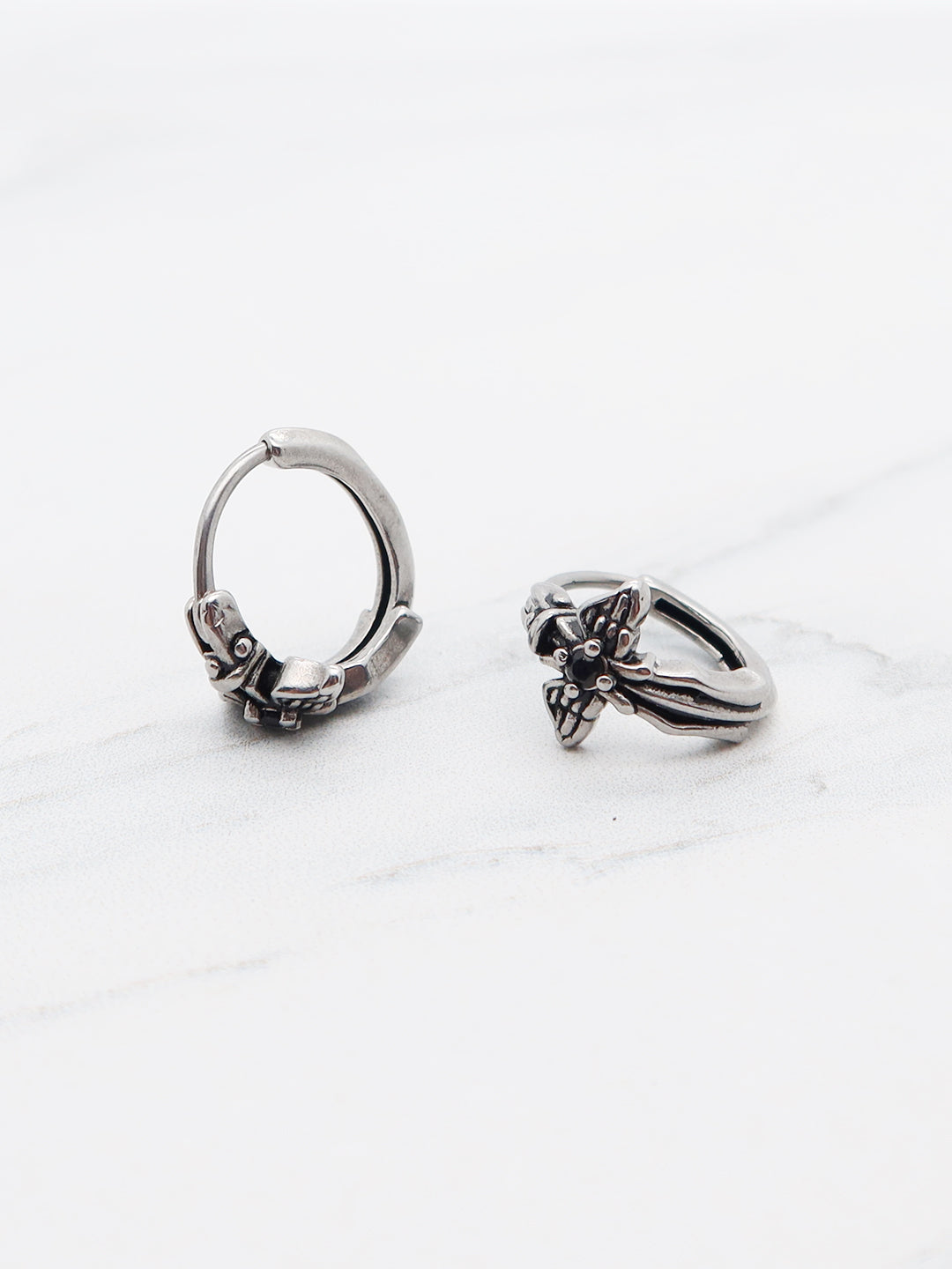 Gothic-style cross hoop earrings made from titanium with intricate details