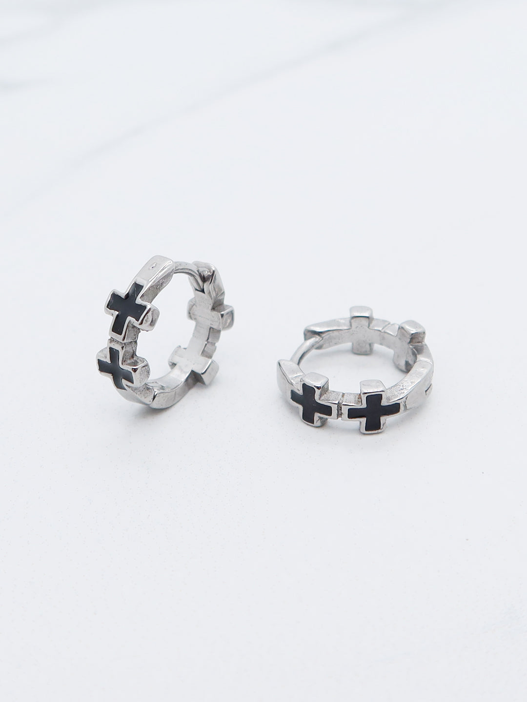 Gothic Cross Hoop Earrings featuring black enamel inlays and stainless steel construction with a high-polish finish.