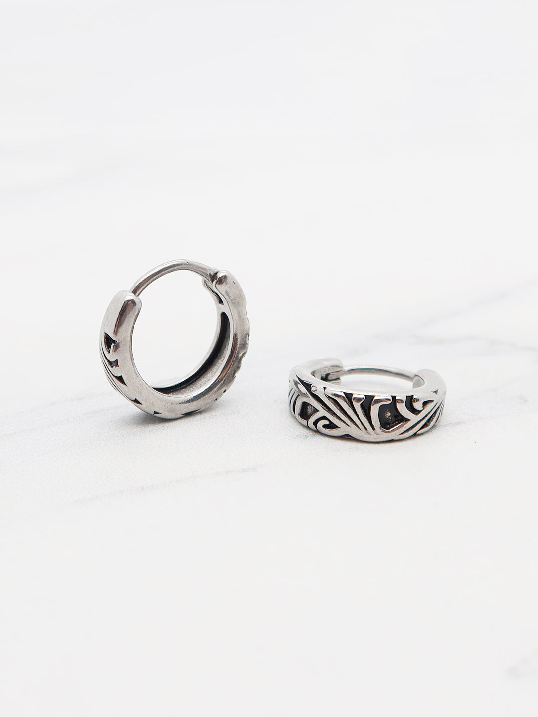 Titanium tribal hoop earring with engraved patterns