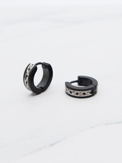 Black and silver titanium hoop earrings with geometric pattern, modern huggie-style design