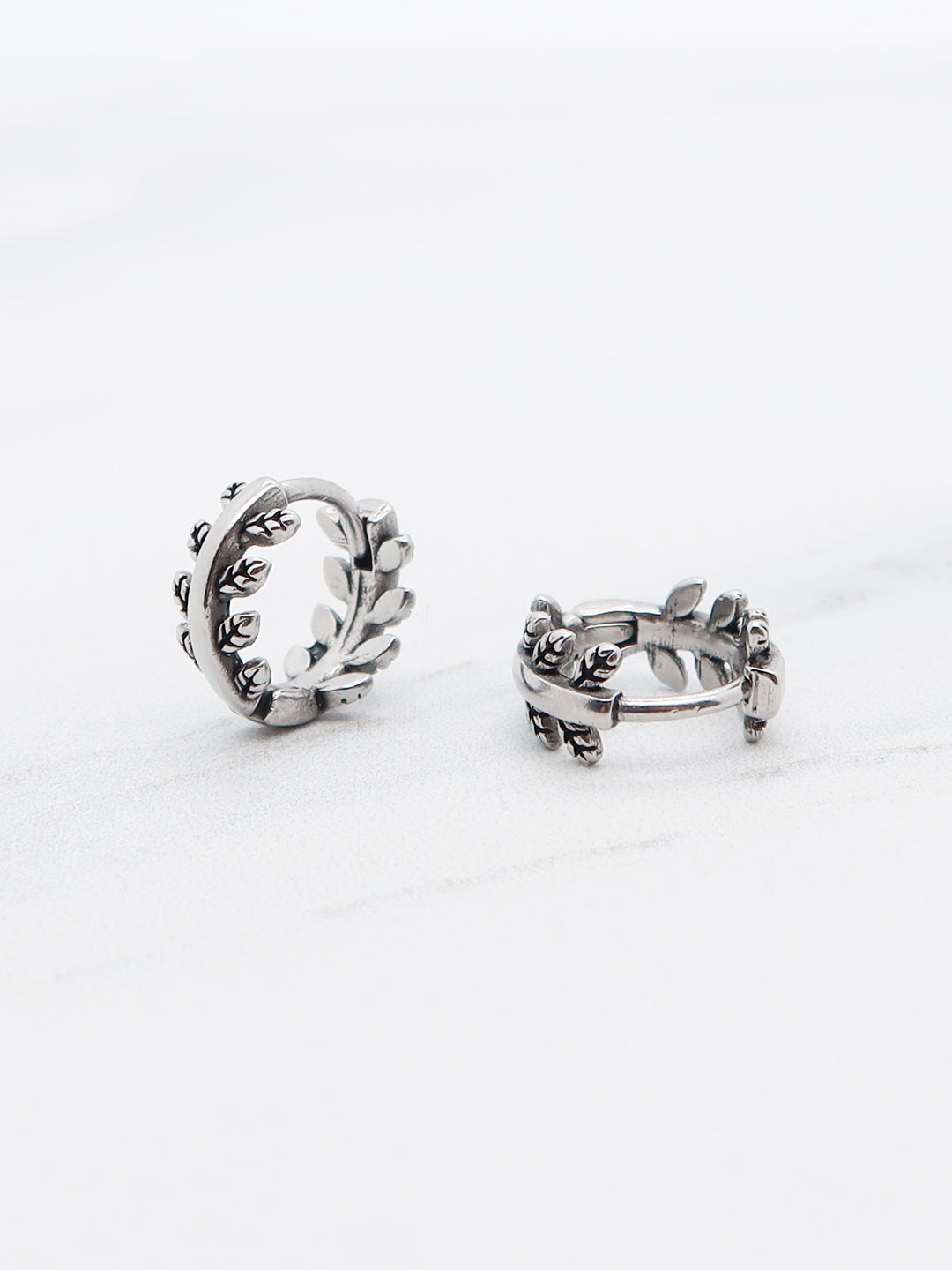 Titanium laurel wreath hoop earrings with leaf design, oxidized silver finish.
