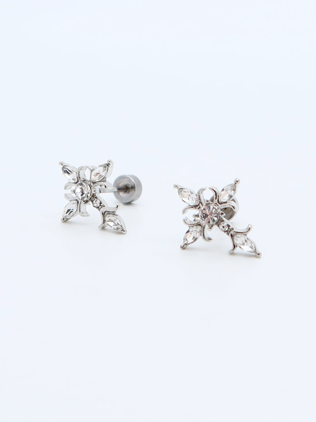 Close-up of Crystal Floral Titanium Earrings with sparkling crystal accents and a floral design.