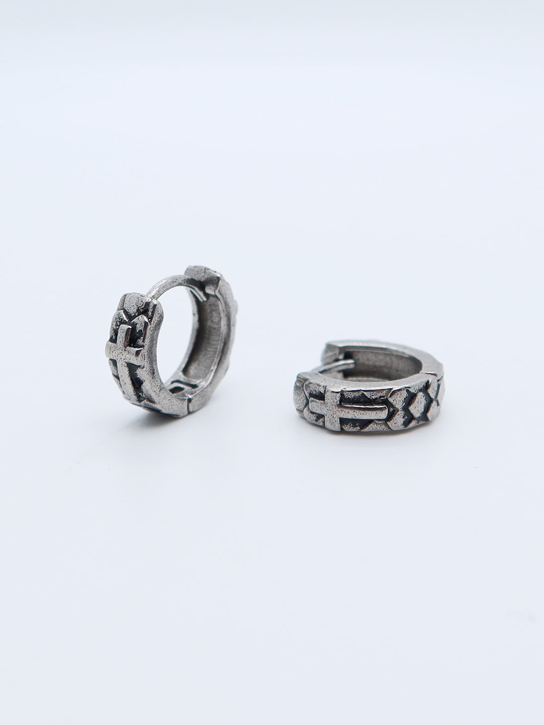 Titanium gothic cross engraved hoop earrings with a secure hinged clasp