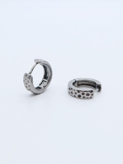 Titanium textured dot hoop earrings with a modern design.